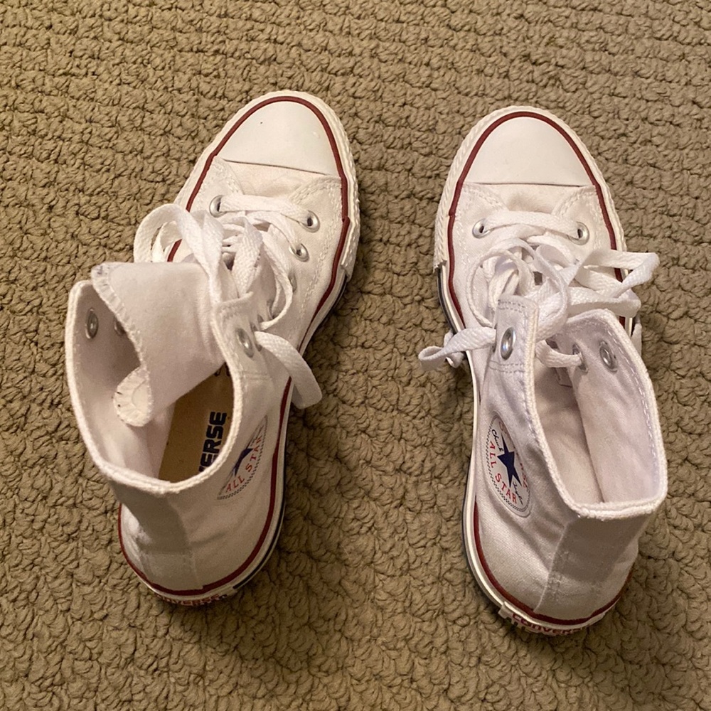 Converse white high top sneakers. Barely worn. Great condition.
